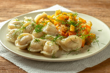 Delicious dumplings with vegetable stew, homemade lunch.