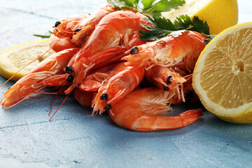Raw fresh Prawns Langostino Austral. shrimp seafood with fresh lemon and spices.