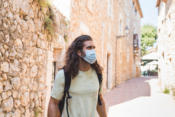 Fototapeta na wymiar a young man wearing a mask outdoors