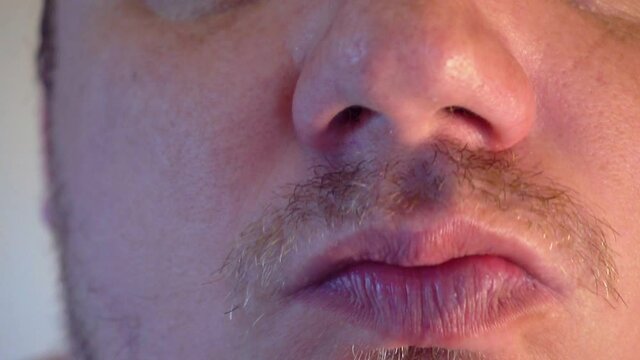 fingers cover the nose from an unpleasant stinky smell.close-up.