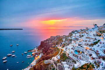 Famous greek iconic selfie spot tourist destination Oia village with traditional white houses and...