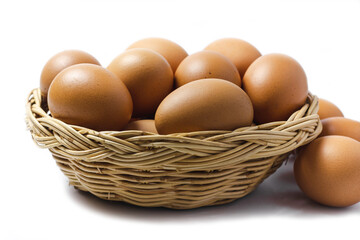 Brown Egg Isolated on White Background. Eggs in the basket