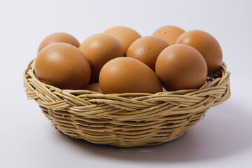 Brown Egg Isolated on White Background. Eggs in the basket