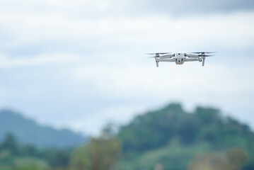 Fototapeta na wymiar Video recording with a drone plane Using video drones