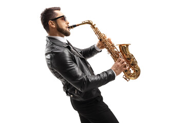 Obraz na płótnie Canvas Profile shot of a musician in a leather jacket wearing sunglasses and playing a saxophone