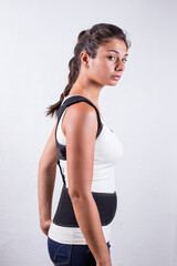 Fototapeta na wymiar Instruction how to wear posture corrector. Different angels. Women wearing back support belt for support and improve posture consists of two parts for the back and lower back. Details, quality