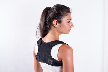 Instruction how to wear posture corrector. Different angels. Women wearing back support belt for...