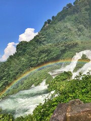 Rainbow on waterfall in the mountains
