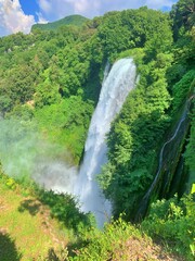man-made waterfall in the mountains in Italy