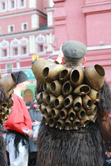 Moscow Maslenitsa Festival . Traditional celebration in folk style. Sardinian masked artists: mamuthones, isohadores from Sardinia, Italy. Ethnic clothes, costumes