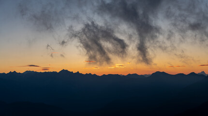 Silhouette Maritime Alps mountain range against sky at sunset, South France
