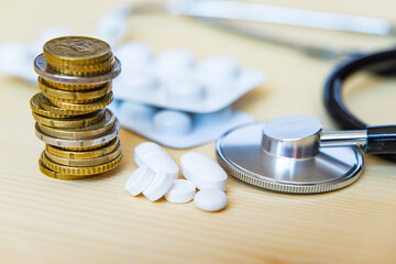 Stethoscope, medicines and coins; health expenditure