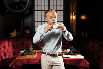 handsome man enjoying with coffee in restaurant 