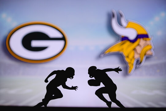 Green Bay Packers vs. Minnesota Vikings. NFL match poster. Two american football players silhouette facing each other on the field. Clubs logo in background. Rivalry concept photo.