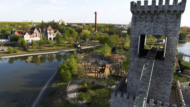Aerial Drone flight over the Theme park Belantis near Leipzig with a roller coaster