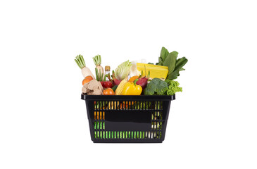 Black plastic grocery basket full of healthy vegetables and fruits,  ingredients isolated on white...