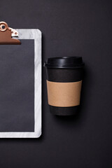 Black take away coffee cup and clipboard blank menu