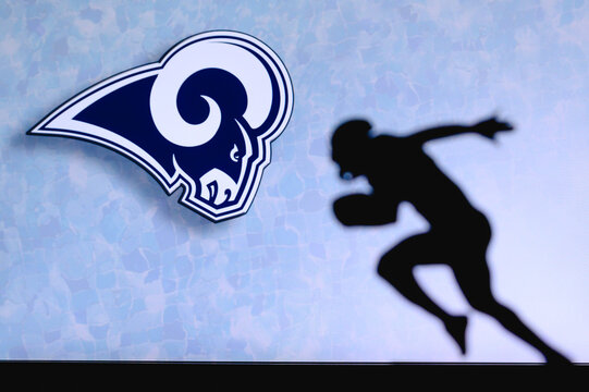 Los Angeles Rams . Silhouette of professional american football player. Logo of NFL club in background, edit space.
