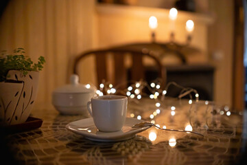 Coffee pouch mockup with coffee cup and milk on dark romantic background. Paper clear bag in candles light