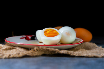 Boiled eggs are placed in a serving dish.