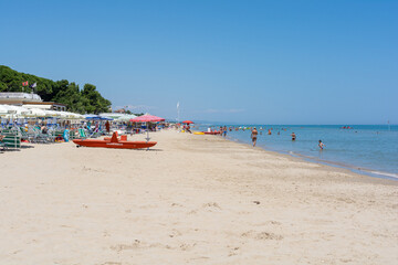 beach with umbrellas and chairs