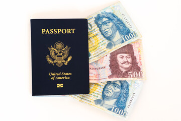 American passport and Hungarian Forint currency. Concept for rich American tourists spending money traveling in Hungary.