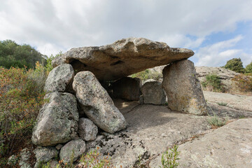 Ancient dolmen of Ladas  during a cloudy day, near Tempio Pausania, north of Sardinia, Italy. 