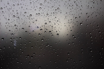 Raindrops on the glass. Raindrops on a sky background. Background. Texture.