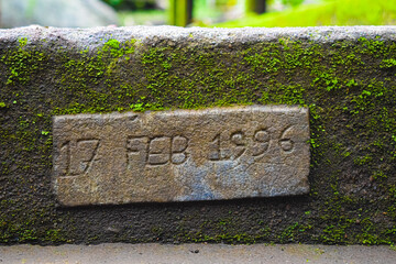 old stone with date written on it