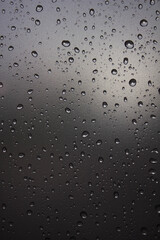 Raindrops on the glass. Raindrops on a sky background. Background. Texture.