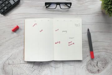 high angle view of weekly planner on table.