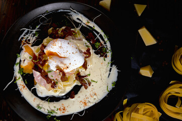 Top view of Organic pasta carbonara dish with bacon and cheese