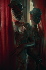 Cosplayers are in image of monsters mannequins.