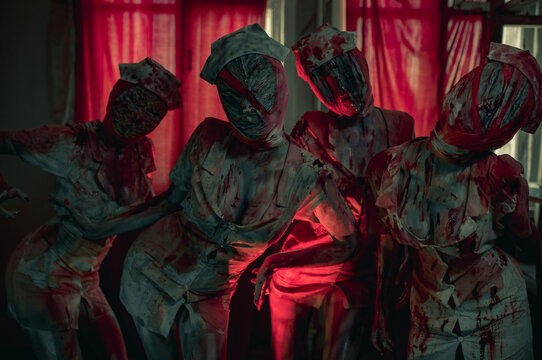 Cosplayers are in image of monsters mannequins.