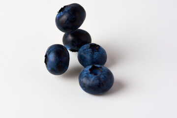 Falling blueberries on a white background