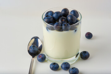 Blueberries with yogurt on a white background