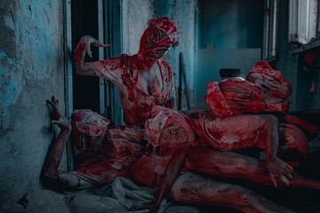 Cosplayers portray bloody monsters mannequins.