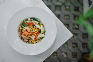 Top view of Stir-fried Spicy Spaghetti Seafood or 