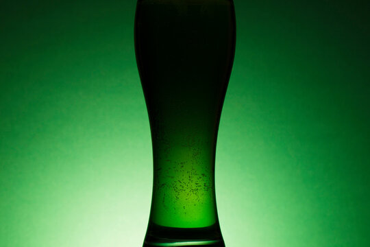 St Patrick's Day green beer silhouette against a green background