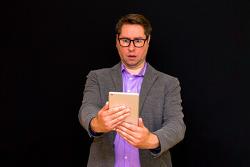 Middle age Business man uses and works with the pc tablet