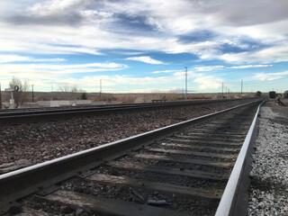 Beautiful sky over railroad tracks in California suburb