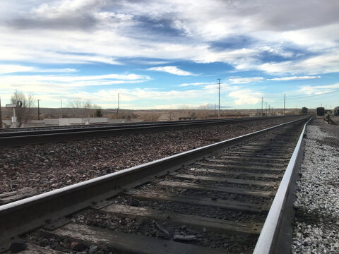 Beautiful sky over railroad tracks in California suburb