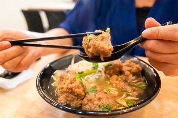 Taiwanese food of soup noodles with pork ribs cakes