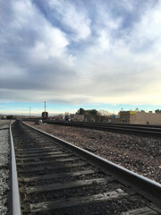 Fototapeta na wymiar Beautiful sky over railroad tracks in California suburb