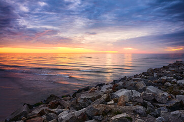 Baltic Sea rocky coast at sunset, Mrzezyno, Poland.