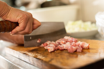 cut raw pork on wooden table