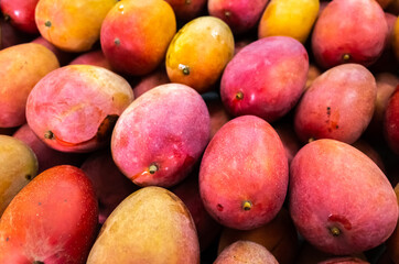 red stacks of mango fruits