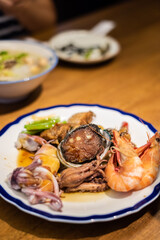 eat plate of seafood on table
