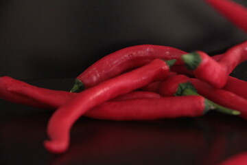 colorful peppers on a black background
