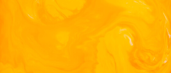Fluid Art. Abstract blurred colorful background. Swirl liquid pattern. Marble effect of orange color. Trendy colorful backdrop. Mixing paints